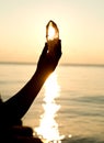 Young woman`s hands holding clear quartz point Royalty Free Stock Photo