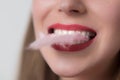 A young woman's mouth with pink sugar cotton Royalty Free Stock Photo