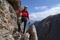 Woman on Via ferrata on mountain