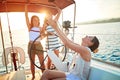 Young woman sailing on boat together and enjoy at sunset on vacation