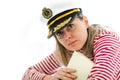 Young woman sailor in captain cap holding book Royalty Free Stock Photo