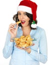 Young Woman in Santa Hat Holding Bowl of Cooked Roast Potatoes Royalty Free Stock Photo