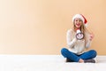 Young woman with santa hat holding a megaphone Royalty Free Stock Photo