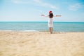 Young woman in santa hat on tropical beach. Christmas vacation. Christmas beach vacation travel woman wearing Santa hat and bikini Royalty Free Stock Photo