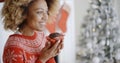 Young woman savoring a Christmas cake