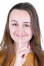 Young woman saying shh keeping secret happy