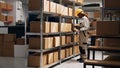 Young woman scanning barcodes on packages to work