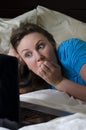 Young woman scared while watching movie Royalty Free Stock Photo