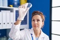 Young woman scientist looking sample working at laboratory Royalty Free Stock Photo