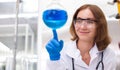 Young women scientist are working research and test chemical with test tubes in laboratory. student medical science experimenting Royalty Free Stock Photo