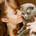 Young woman with scottish-fold cat Royalty Free Stock Photo