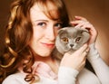 Young woman with scottish-fold cat Royalty Free Stock Photo