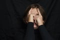Young woman screaming, hate, rage and put her hands on face. Crying emotional angry woman screaming on black background. Emotional Royalty Free Stock Photo