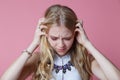 young woman screaming from pain and holding her head with selective focus Royalty Free Stock Photo