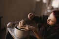 Young woman sculptor artist creating a bust sculpture Royalty Free Stock Photo