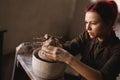 Young woman sculptor artist creating a bust sculpture Royalty Free Stock Photo