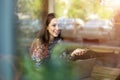 Woman seen through cafe window Royalty Free Stock Photo