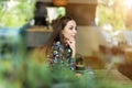 Woman seen through cafe window Royalty Free Stock Photo