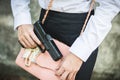 Young woman self defence putting gun Royalty Free Stock Photo