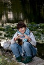 Young woman sending love heart