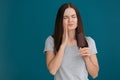 Young woman with sensitive teeth and cold ice cream on color background Royalty Free Stock Photo