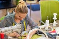 Young woman with sewing machine Royalty Free Stock Photo