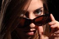 Young woman with look in dark sunglasses