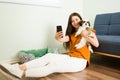 Young woman sharing her love for dogs online Royalty Free Stock Photo
