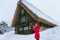 Young woman in Shirakawa-go village in winter, UNESCO world heritage sites, Japan