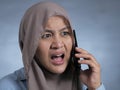 Young Woman Shocked by Phone Call Royalty Free Stock Photo