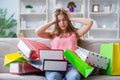 The young woman with shopping bags indoors home on sofa Royalty Free Stock Photo