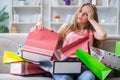 The young woman with shopping bags indoors home on sofa Royalty Free Stock Photo