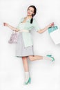 Young woman with shopping bags on isolated background Royalty Free Stock Photo