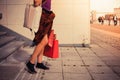 Young woman with shopping bags by stairs at sunset Royalty Free Stock Photo