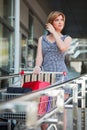 Young woman with shopping cart Royalty Free Stock Photo