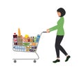 Young woman with shopping cart full of food and drinks Royalty Free Stock Photo