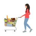 Young woman with shopping cart full of food Royalty Free Stock Photo