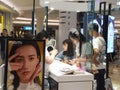 Shenzhen, China: young woman shopping for contact lenses