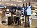 Shenzhen, China: young woman shopping for contact lenses