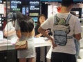 Shenzhen, China: young woman shopping for contact lenses