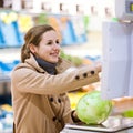 young woman shopping for fruits and vegetables Royalty Free Stock Photo