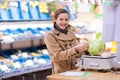 Young woman shopping for fruits and vegetables Royalty Free Stock Photo