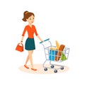 Young woman shopping in a grocery store, in basket products. Royalty Free Stock Photo