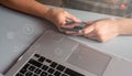 Young woman shopping  on line, Using smart phone and laptop computer Royalty Free Stock Photo