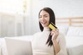 Young Woman shopping online with  credit card and  laptop at home Royalty Free Stock Photo