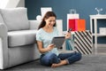 Young woman shopping online with credit card and tablet PC at home Royalty Free Stock Photo