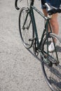 Young woman in shorts near the city bike fixedgear