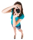 Young woman in shorts photographed something compact camera. Royalty Free Stock Photo