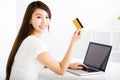 young woman showing credit card and laptop Royalty Free Stock Photo