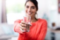 Young woman showing drinking glass with water Royalty Free Stock Photo